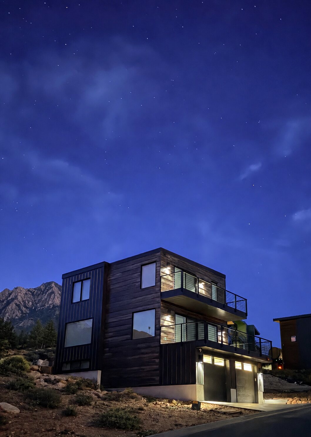 The home at dusk under the stars